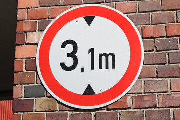High limitation road sign on the brick wall