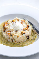 risotto with mussels, sauce and parmesan cheese