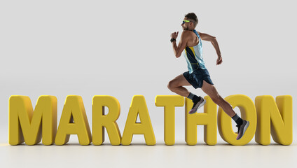 Triathlon male athlete running along 3d lettering Marathon over white background. Concept of...