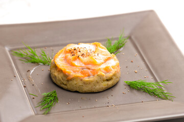 salty cake filled with cream cheese served with smoked salmon and dill