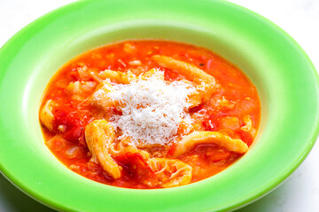 tripe and tomato soup with parmesan cheese