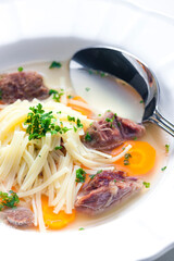 beef broth with noodles and carrot