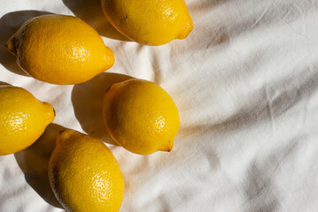 fresh lemons on white sheets