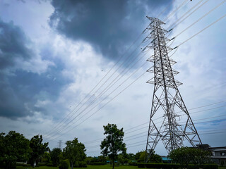 Obraz premium High power electric poles and lines at or high voltage towers with blue sky, 