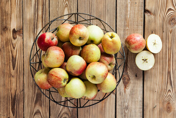 fresh and juicy apples on a wooden background