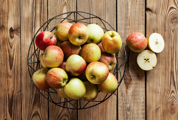 fresh and juicy apples on a wooden background