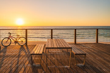 Picnic table on the beach at sunset, Somerton Park, South Australia