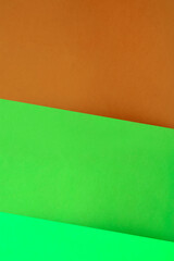 Abstract Background consisting Dark and light shades of yellow green orange  to create a three fold creative cover design