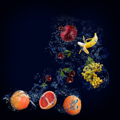 Obraz na płótnie Canvas Wallpaper, panorama with fruits in the water - grapefruit, pomegranate, banana, grapes, cherries are very tasty and good for the body