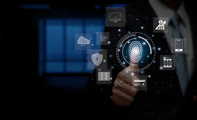 Fototapeta premium Businessman touching fingerprint scanning icon on virtual screen, personal information access concept for various transactions with internet technology online for security, banking