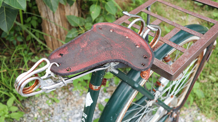 Broken rusty old and traditional bicycle seat