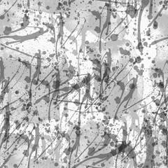 A seamless pattern with monochrome paint splatters on a white background.
