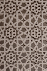 Arabic style carved stone arabesque openwork on a building facade in Old Dubai (Deira), with star...