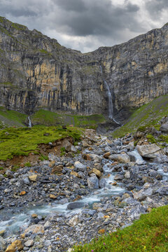 Typical alpine landscape with waterfalls, Swiss Alps near Klausenstrasse, Spiringen, Canton of Uri, Switzerland