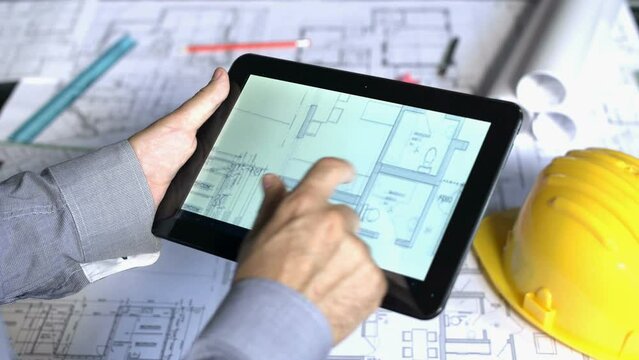 Architect working on digital tablet