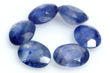 Natural gemstone blue sapphire isolated on white background