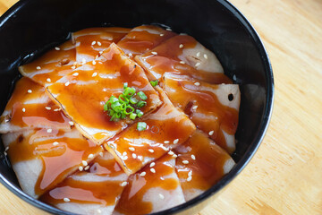 Burnt bacon with teriyaki sauce on Japanese rice. Donburi menu.