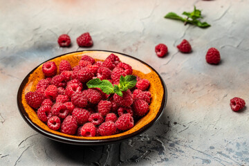 Organic raspberries, Fresh raspberries in bowl. Ripe juicy fresh raspberries. healthy food,...
