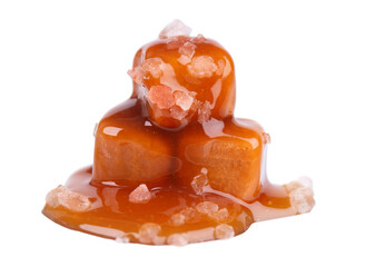 Sweet caramel candies and sauce, isolated on white background. Delicious salty caramel.