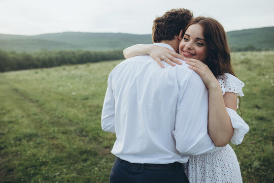 Young smiling wedding couple in nature. Happy bride and stylish groom. Wedding. High quality photo