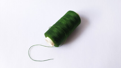 skein of green yarn on a white background