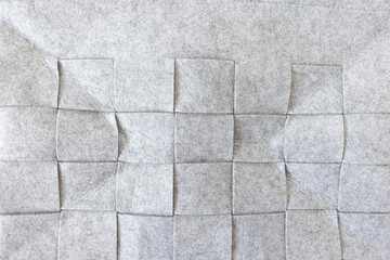 Abstract gray felt texture background. Square pattern. Home storage