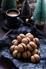 Lady's kisses, traditional Italian nut cookies with coffee and chocolate filling.
