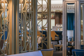 Elegant Art Deco interior design furnishing bar lounge area onboard ocean liner cruiseship cruise...