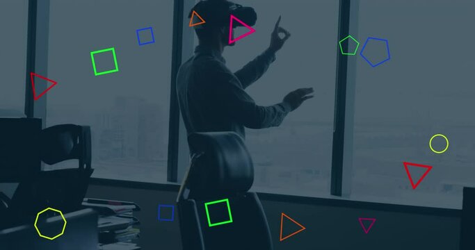 Animation of colorful geometric shapes over caucasian businessman gesturing while vr headset