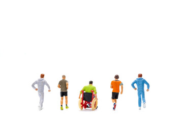 Fototapeta premium Miniature people Disabled happy friends having fun together on white background 