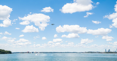 Sea plane in the air flying over the Atlantic Ocean and Boston Harbor.