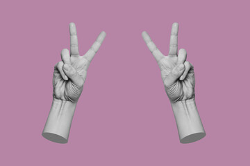 Two female hands showing a peace gesture isolated on a purple color background. Trendy collage in...
