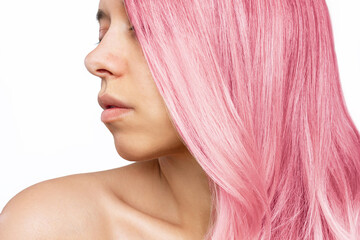 Fototapeta premium Portrait of young woman with pink tinted hair isolated on white background. Result of coloring, tinting. Light delicate color. Beauty and fashion