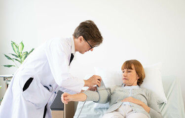 Obraz premium Asian senior adult retired stay at nursing home with take care healthcare and medicine by doctor and nurse. old elderly people working out exercise at nursing home, training and physical therapy,