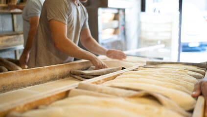 Bakers bring leavened bread to the oven early in the morning, traditional bakery