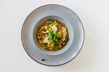 Soup seefood with shitake and onion and gyoza