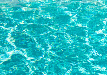 Fototapeta na wymiar blue color background of swimming pool water with ripples in malibu