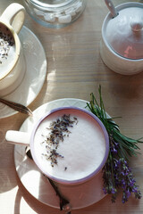 A cup of home made london fog tea latte drink with lavender flower buds, good morning concept, flat lay.