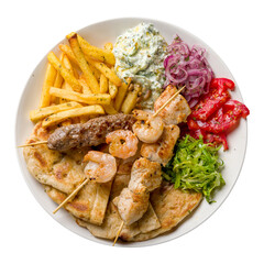 souvlaki with chicken, shrimp kebab and beef lula kebab with french fries, vegetables and pita on white plate isolated on white background top view