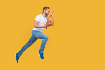 Fototapeta na wymiar angry man shouting with telephone call. man call isolated on yellow background. man has urgent call