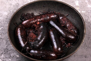 Whole blood sausages on a metal pan,Traditional latvian blood sausages