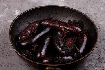 Whole blood sausages on a metal pan,Traditional latvian blood sausages