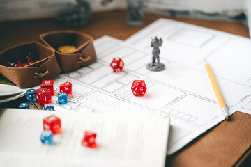 D20 dice place on character paper for create begin fantasy and adventure role playing tabletop and...
