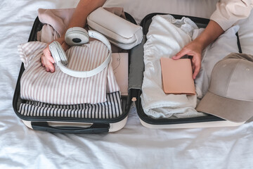 Travel. Staycation.local travel new normal.Girl traveler packing luggage in suitcase Travel,tourism,vacation,relocation.Mental health and travel vacation Film grain