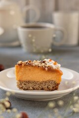 Slice of pumpkin vegan cheesecake without sugar