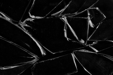 Shards of broken glass on a black background.