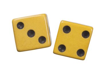 Antique dice with aged yellow patina macro isolated.