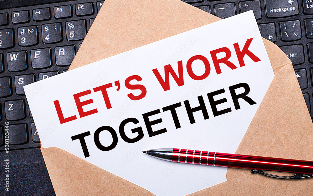 Poster white card with the text let is work together in a craft envelope on a work desk with a modern lapto