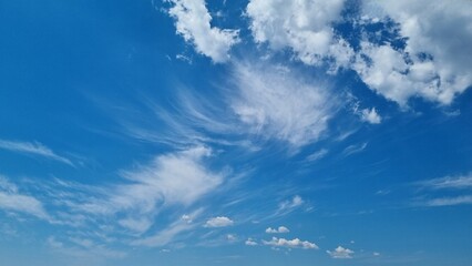 Naklejka na ściany i meble Blue sky with clouds. Beautiful natural background. Ready to wallpaper
