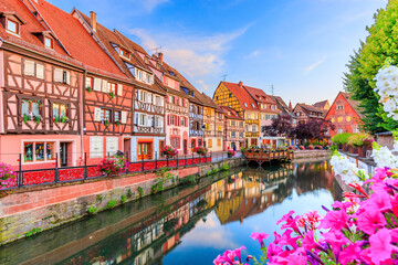 Colmar, Alsace, France. Petite Venice, water canal and traditional half timbered houses.
